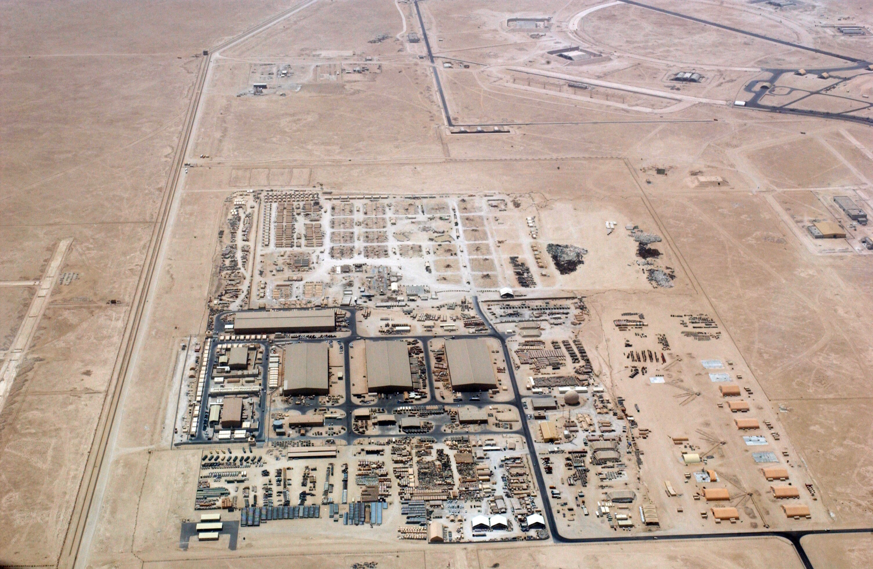 An aerial overhead view of "Ops Town" at at Al Udeid Air Base (AB), Al Rayyan Province, Qatar (QAT), taken from a US Air Force (USAF) KC-135 Stratotanker during Operation IRAQI FREEDOM.