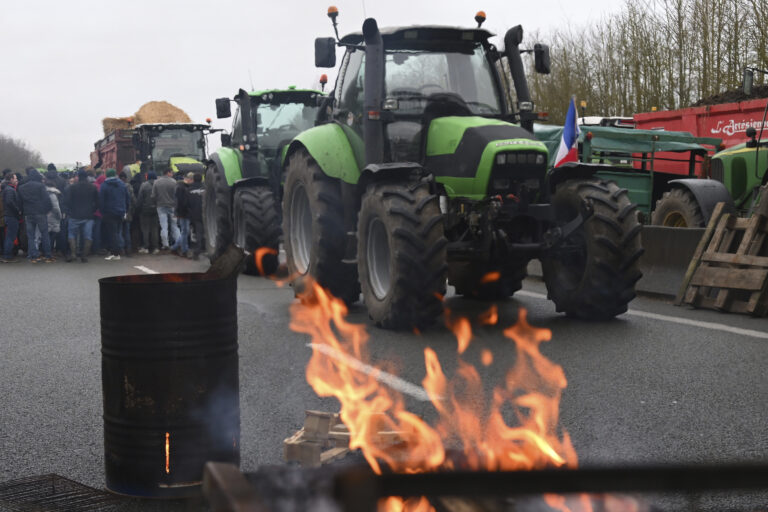 Farmers block a highway during a demonstration Tuesday, Jan. 23, 2024 near Beauvais, northern France. Farmers have for months been protesting for better pay and against what they consider to be excessive regulation, mounting costs and other problems. (AP Photo/Matthieu Mirville)